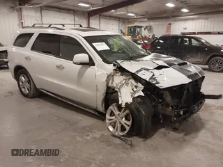 2013 Dodge Durango Crew z VIN 1C4RDJDG5DC670415, wystawiony jako IAAI lot #41890359 z przebiegiem 272 904 mil mil oraz . Historia ofert i sprzedaży dostępna na DreamBid. Obrazek 1.