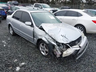 2003 Mazda Protege DX with VIN JM1BJ225330147296, listed as a IAAI auction lot 41484396 with 222,448 mi miles and . Bid and sale history available at DreamBid. Image 1.