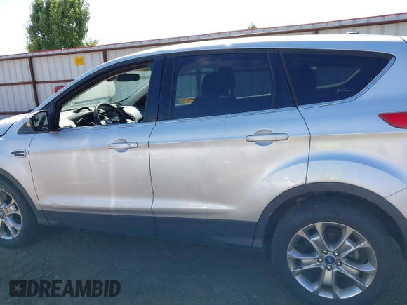 2013 Ford Escape SEL with VIN 1FMCU0H96DUA30733, listed as a IAAI auction lot 42737439 with 106,651 mi miles and . Bid and sale history available at DreamBid. Image 14.