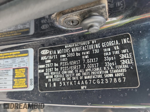 2012 Kia Sorento LX z VIN 5XYKT4A67CG237867, wystawiony jako Copart lot #59290895 z przebiegiem 276 190 mil mil oraz Szkoda całkowita • Salvage title. Historia ofert i sprzedaży dostępna na DreamBid. Obrazek 13.
