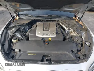 2015 Infiniti Q50 Premium z VIN JN1BV7AR8FM417712, wystawiony jako IAAI lot #41427839 z przebiegiem 88 424 mil mil oraz . Historia ofert i sprzedaży dostępna na DreamBid. Obrazek 10.