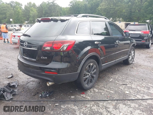 2015 Mazda CX-9 Grand Touring with VIN JM3TB2DA1F0464517, listed as a IAAI auction lot 42484985 with 104,932 mi miles and . Bid and sale history available at DreamBid. Image 4.