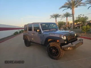 2015 Jeep Wrangler Unlimited Willys Wheeler with VIN 1C4BJWDG3FL543379, listed as a Copart auction lot 52651225 with 95,567 mi miles and Salvage Title. Bid and sale history available at DreamBid. Image 1.