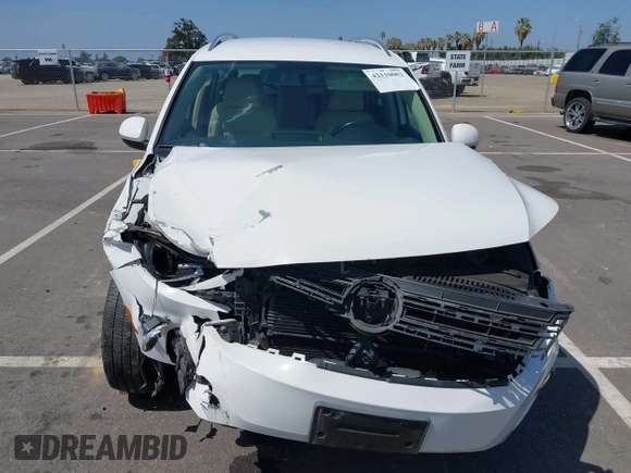 2014 Volkswagen Tiguan SEL with VIN WVGAV3AX9EW512956, listed as a IAAI auction lot 42110002 with 136,034 mi miles and . Bid and sale history available at DreamBid. Image 12.