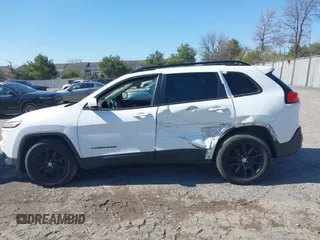 2014 Jeep Cherokee Latitude with VIN 1C4PJMCS9EW309289, listed as a IAAI auction lot 42003252 with 99,360 mi miles and . Bid and sale history available at DreamBid. Image 14.