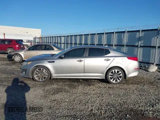2015 Kia Optima SX z VIN 5XXGR4A72FG419739, wystawiony jako IAAI lot #41972453 z przebiegiem 204 336 mil mil oraz . Historia ofert i sprzedaży dostępna na DreamBid. Obrazek 14.