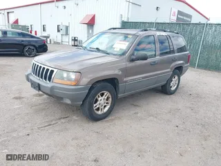 2002 Jeep Grand Cherokee Laredo with VIN 1J4GW48S32C123720, listed as a IAAI auction lot 41909204 with 157,996 mi miles. Bid and sale history available at carsss.com. Image 2.