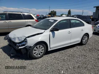 2014 Volkswagen Jetta S with VIN 3VW2K7AJ2EM303673, listed as a Copart auction lot 62909235 with 69,592 mi miles and Salvage title. Bid and sale history available at DreamBid. Image 1.
