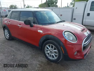 2016 MINI Cooper Hardtop 4 Door S with VIN WMWXU3C56G2D30140, listed as a IAAI auction lot 41883406 with 120,705 mi miles. Bid and sale history available at carsss.com. Image 1.