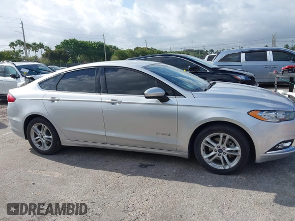 2018 Ford Fusion SE z VIN 3FA6P0LU2JR281231, wystawiony jako IAAI lot #41963083 z przebiegiem 115 434 mil mil oraz . Historia ofert i sprzedaży dostępna na DreamBid. Obrazek 13.