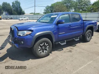 2023 Toyota Tacoma SR with VIN 3TMCZ5AN7PM584205, listed as a Copart auction lot 63983135 with 26,048 mi miles and Salvage title. Bid and sale history available at DreamBid. Image 1.