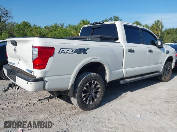 2016 Nissan Titan Platinum Reserve with VIN 1N6BA1F4XGN517905, listed as a IAAI auction lot 42676671 with 110,004 mi miles and . Bid and sale history available at DreamBid. Image 4.