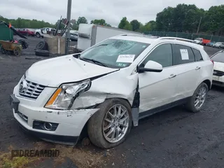 2013 Cadillac SRX Performance Collection with VIN 3GYFNHE34DS628486, listed as a IAAI auction lot 42530124 with 76,778 mi miles and . Bid and sale history available at DreamBid. Image 2.
