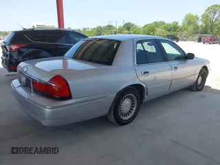 2001 Mercury Grand Marquis LS z VIN 2MEFM75W91X660964, wystawiony jako IAAI lot #42250931 z przebiegiem 74 462 mil mil oraz . Historia ofert i sprzedaży dostępna na DreamBid. Obrazek 4.