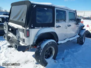 2010 Jeep Wrangler Unlimited Sport with VIN 1J4BA3H11AL102891, listed as a IAAI auction lot 41576869 with 213,204 mi miles. Bid and sale history available at carsss.com. Image 4.