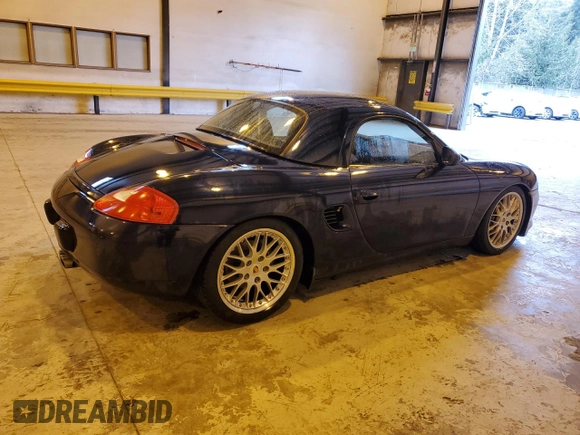 1999 Porsche Boxster z VIN WP0CA2983XU630435, wystawiony jako Copart lot #47402785 z przebiegiem 62 180 mil mil oraz Szkoda całkowita • Salvage title. Historia ofert i sprzedaży dostępna na DreamBid. Obrazek 3.