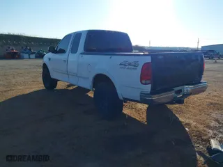 1998 Ford F-150 Standard with VIN 1FTZX18W4WKB71994, listed as a IAAI auction lot 41450074 with 202,784 mi miles. Bid and sale history available at carsss.com. Image 3.