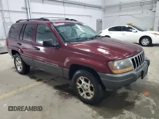 2001 Jeep Grand Cherokee Laredo with VIN 1J4GW48S11C618478, listed as a Copart auction lot 57889965 with Not provided miles and Clean title. Bid and sale history available at DreamBid. Image 4.