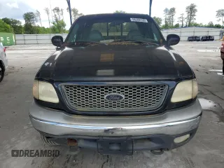 2001 Ford F-150 XLT z VIN 1FTRW08L31KE62434, wystawiony jako Copart lot #56282735 z przebiegiem Nie podano mil oraz Czysty tytuł • Clean title. Historia ofert i sprzedaży dostępna na DreamBid. Obrazek 5.