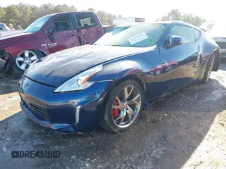 2014 Nissan 370Z Nismo with VIN JN1AZ4EH9EM635608, listed as a IAAI auction lot 41333034 with 45,354 mi miles and . Bid and sale history available at DreamBid. Image 2.