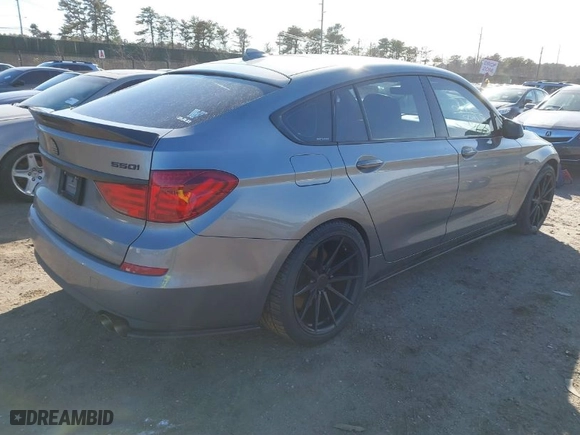 2011 BMW 5 Series Gran Turismo 550i xDrive with VIN WBASP4C52BC341644, listed as a IAAI auction lot 41694573 with 202,983 mi miles. Bid and sale history available at carsss.com. Image 4.