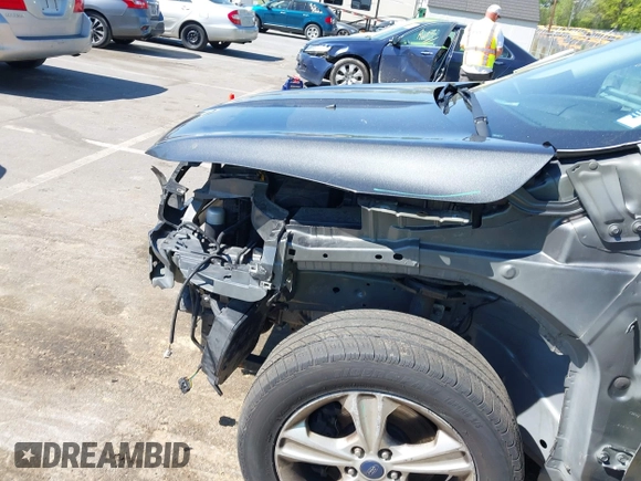 2015 Ford Escape SE with VIN 1FMCU9G98FUB04601, listed as a IAAI auction lot 42020737 with 176,487 mi miles and . Bid and sale history available at DreamBid. Image 13.