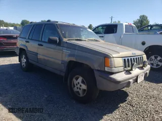 1995 Jeep Grand Cherokee Laredo with VIN 1J4FX58S1SC754691, listed as a Copart auction lot 72858214 with 251,234 mi miles and Salvage Title. Bid and sale history available at carsss.com. Image 4.