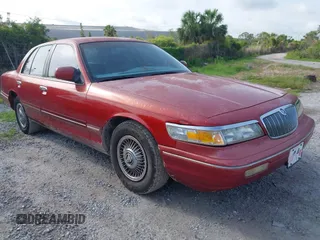 1997 Mercury Grand Marquis GS z VIN 2MELM74W4VX723365, wystawiony jako IAAI lot #42418646 z przebiegiem 197 362 mil mil oraz . Historia ofert i sprzedaży dostępna na DreamBid. Obrazek 1.