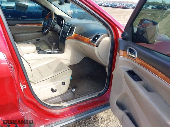 2011 Jeep Grand Cherokee Overland with VIN 1J4RR6GT9BC652336, listed as a IAAI auction lot 42028574 with 223,253 mi miles. Bid and sale history available at carsss.com. Image 5.