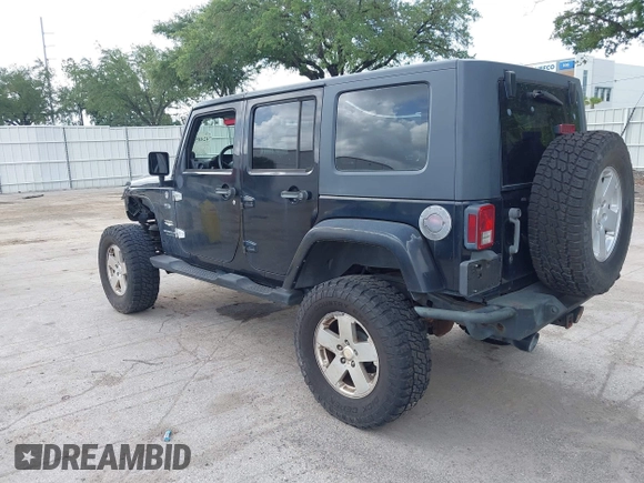 2007 Jeep Wrangler Unlimited Sahara z VIN 1J8GA59187L104774, wystawiony jako IAAI lot #42485359 z przebiegiem 192 254 mil mil oraz . Historia ofert i sprzedaży dostępna na DreamBid. Obrazek 3.