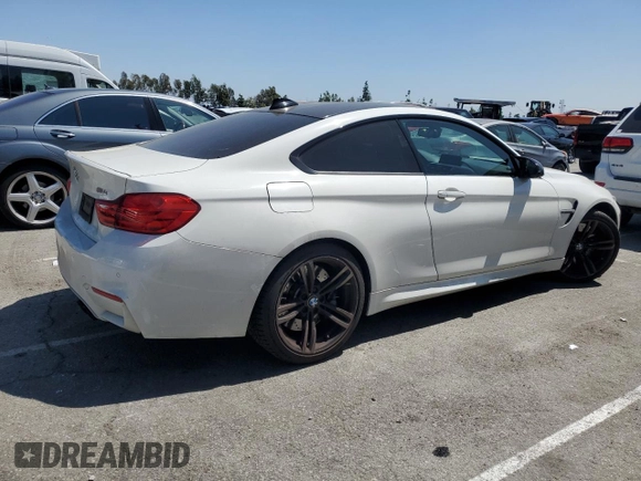 2015 BMW M4 with VIN WBS3R9C51FK334414, listed as a Copart auction lot 52451035 with 122,436 mi miles and Salvage title. Bid and sale history available at DreamBid. Image 3.