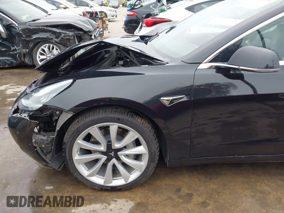 2018 Tesla Model 3 Long Range Battery with VIN 5YJ3E1EB3JF090567, listed as a IAAI auction lot 41568312 with 35,327 mi miles and . Bid and sale history available at DreamBid. Image 22.