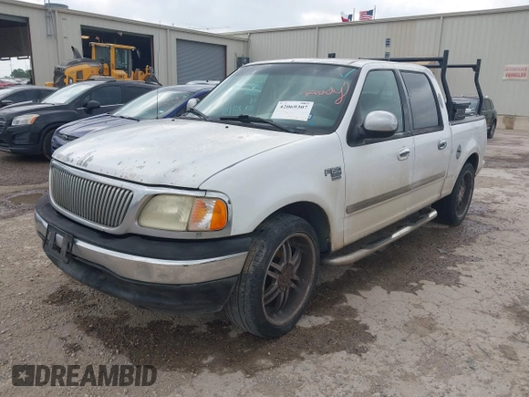2002 Ford F-150 XLT with VIN 1FTRW07602KB74836, listed as a IAAI auction lot 42069307 with 295,692 mi miles. Bid and sale history available at carsss.com. Image 2.