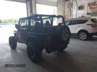 1999 Jeep Wrangler Sport with VIN 1J4FY19S4XP494405, listed as a IAAI auction lot 42542416 with 168,856 mi miles and . Bid and sale history available at DreamBid. Image 3.