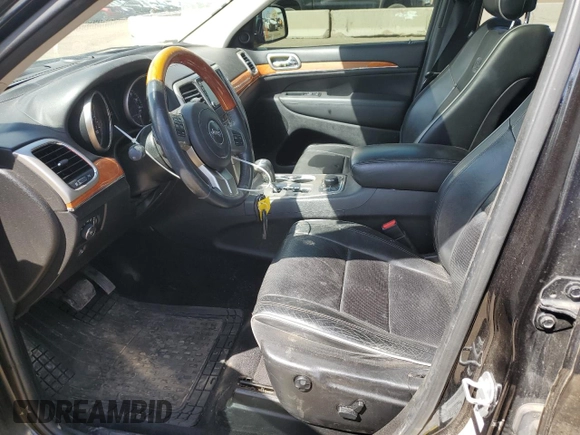 2013 Jeep Grand Cherokee Overland with VIN 1C4RJFCG5DC638927, listed as a Copart auction lot 52752615 with 117,494 mi miles and Salvage Title. Bid and sale history available at carsss.com. Image 7.