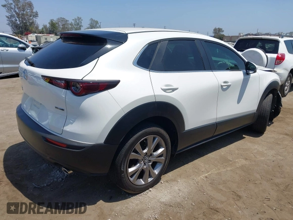 2021 Mazda CX-30 Select with VIN 3MVDMBBL9MM313039, listed as a IAAI auction lot 42575424 with 21,083 mi miles and . Bid and sale history available at DreamBid. Image 4.