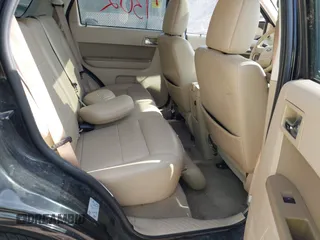 2010 Ford Escape Limited z VIN 1FMCU9EG0AKC58211, wystawiony jako IAAI lot #42697302 z przebiegiem 166 337 mil mil oraz . Historia ofert i sprzedaży dostępna na DreamBid. Obrazek 8.