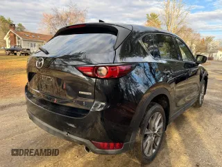 2020 Mazda CX-5 Grand Touring with VIN JM3KFADM8L0785373, listed as a Copart auction lot 50829175 with 135,736 mi miles and Clean Title. Bid and sale history available at DreamBid. Image 4.