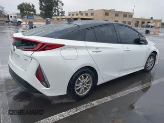 2021 Toyota Prius LE with VIN JTDKAMFP0M3169019, listed as a IAAI auction lot 41481098 with 84,304 mi miles and . Bid and sale history available at DreamBid. Image 4.