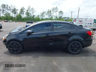 2014 Kia Rio LX with VIN KNADM4A33E6335499, listed as a IAAI auction lot 42123085 with 148,146 mi miles and . Bid and sale history available at DreamBid. Image 14.