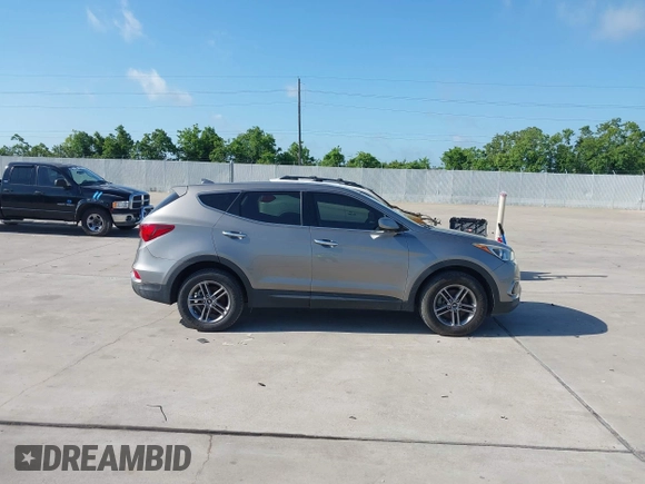 2017 Hyundai Santa Fe 2.4L z VIN 5XYZTDLB7HG444033, wystawiony jako IAAI lot #42263907 z przebiegiem 107 454 mil mil oraz . Historia ofert i sprzedaży dostępna na DreamBid. Obrazek 13.