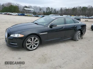 2015 Jaguar XJ with VIN SAJWA1CZ1F8V85402, listed as a Copart auction lot 86717734 with 201,249 mi miles and Salvage Title. Bid and sale history available at carsss.com. Image 1.