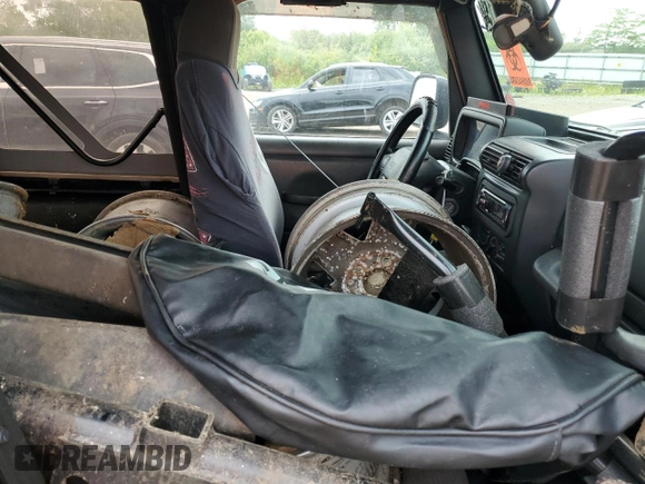 2004 Jeep Wrangler Rubicon z VIN 1J4FA69S24P713388, wystawiony jako Copart lot #61196515 z przebiegiem 155 092 mil mil oraz Czysty tytuł • Clean title. Historia ofert i sprzedaży dostępna na DreamBid. Obrazek 11.