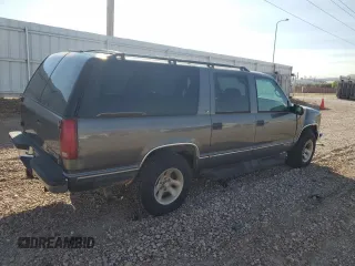 1999 Chevrolet Suburban with VIN 1GNFK16R4XJ483035, listed as a Copart auction lot 76666034 with 215,048 mi miles and Clean Title. Bid and sale history available at carsss.com. Image 3.