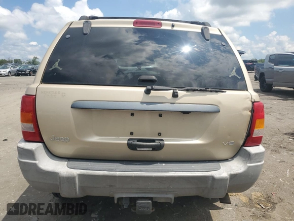 1999 Jeep Grand Cherokee Laredo with VIN 1J4GW58N7XC799434, listed as a Copart auction lot 64790905 with 272,384 mi miles and Salvage title. Bid and sale history available at DreamBid. Image 6.