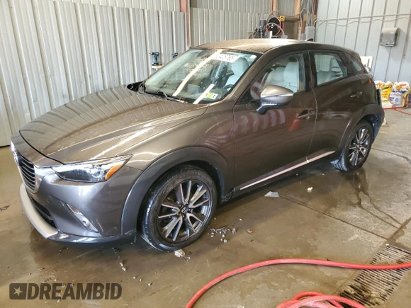 2016 Mazda CX-3 Grand Touring z VIN JM1DKFD74G0137815, wystawiony jako Copart lot #52405765 z przebiegiem 128 922 mil mil oraz Szkoda całkowita • Salvage title. Historia ofert i sprzedaży dostępna na DreamBid. Obrazek 1.