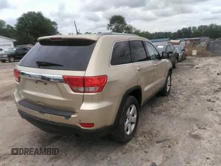 2012 Jeep Grand Cherokee Laredo with VIN 1C4RJEAGXCC157616, listed as a IAAI auction lot 42156539 with 301,661 mi miles. Bid and sale history available at carsss.com. Image 4.