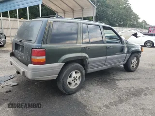 1995 Jeep Grand Cherokee Laredo with VIN 1J4FX58S0SC726476, listed as a Copart auction lot 69608784 with 264,705 mi miles and Salvage Title. Bid and sale history available at carsss.com. Image 3.