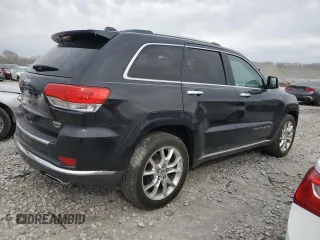2014 Jeep Grand Cherokee Summit with VIN 1C4RJFJG1EC323658, listed as a Copart auction lot 50740115 with 253,656 mi miles and Salvage title. Bid and sale history available at DreamBid. Image 3.