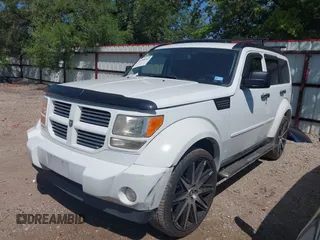 2011 Dodge Nitro Heat with VIN 1D4PT4GX9BW587284, listed as a IAAI auction lot 41998357 with 100,366 mi miles and . Bid and sale history available at DreamBid. Image 2.